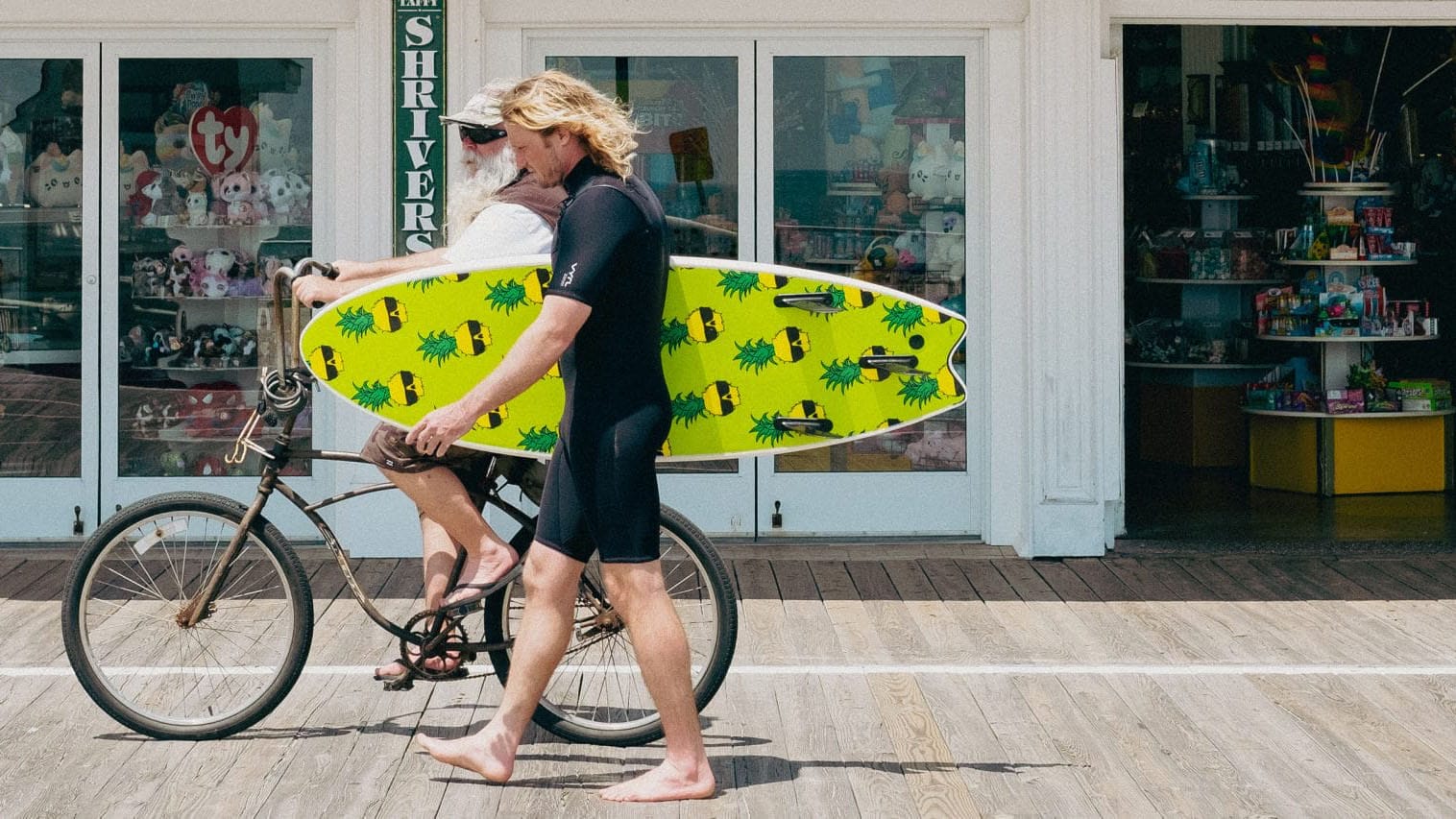 person walking with surf board