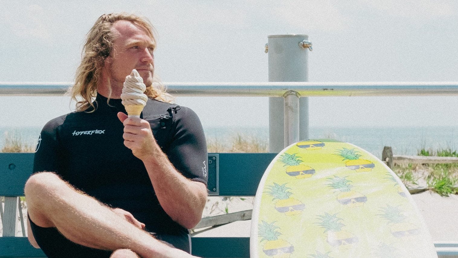 person siting with surf board
